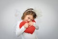 Young girl holding a plush red heart Royalty Free Stock Photo